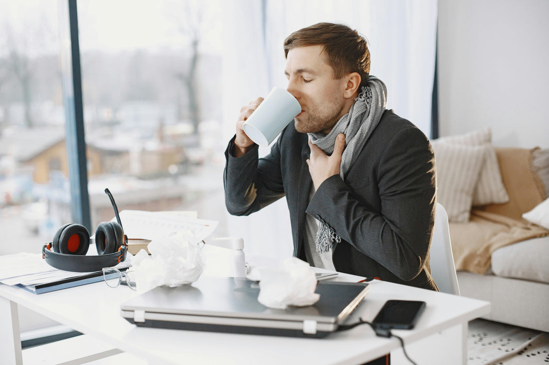 person drinking from a cup
