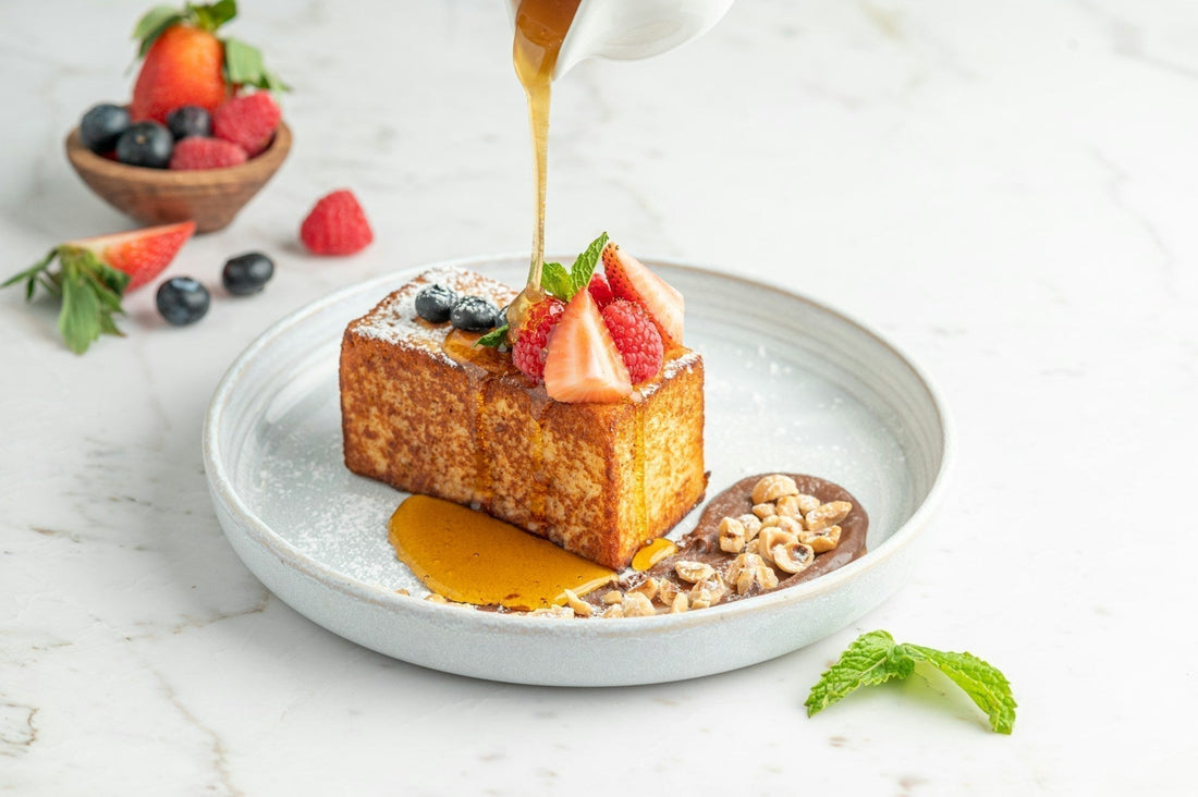 a piece of cake is being drizzled with honey