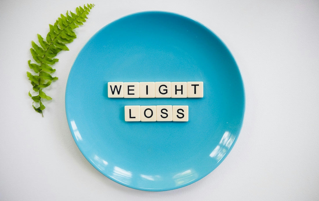 blue plate with the words "weight loss" on it